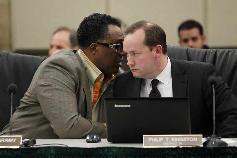  Council member Dwaine Caraway, who will hand his seat over to a successor Monday, confers...