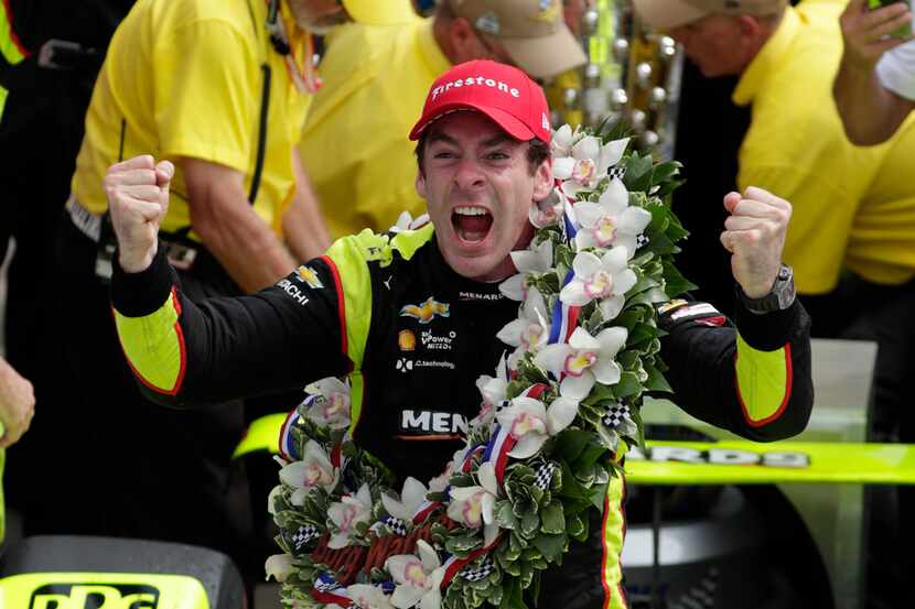 Simon Pagenaud, of France, celebrates after winning the Indianapolis 500 IndyCar auto race...