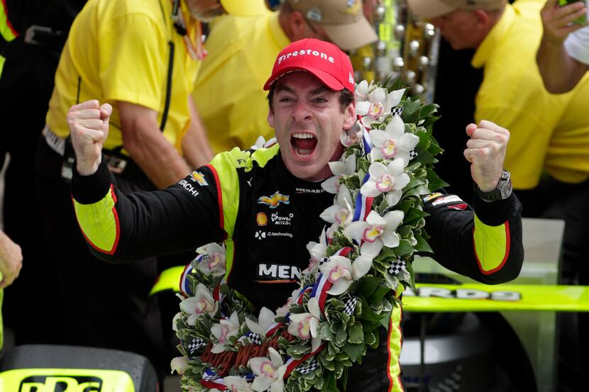 Simon Pagenaud, of France, celebrates after winning the Indianapolis 500 IndyCar auto race...