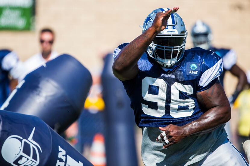 Dallas Cowboys defensive tackle Maliek Collins (96) attacks a dummy during an afternoon...