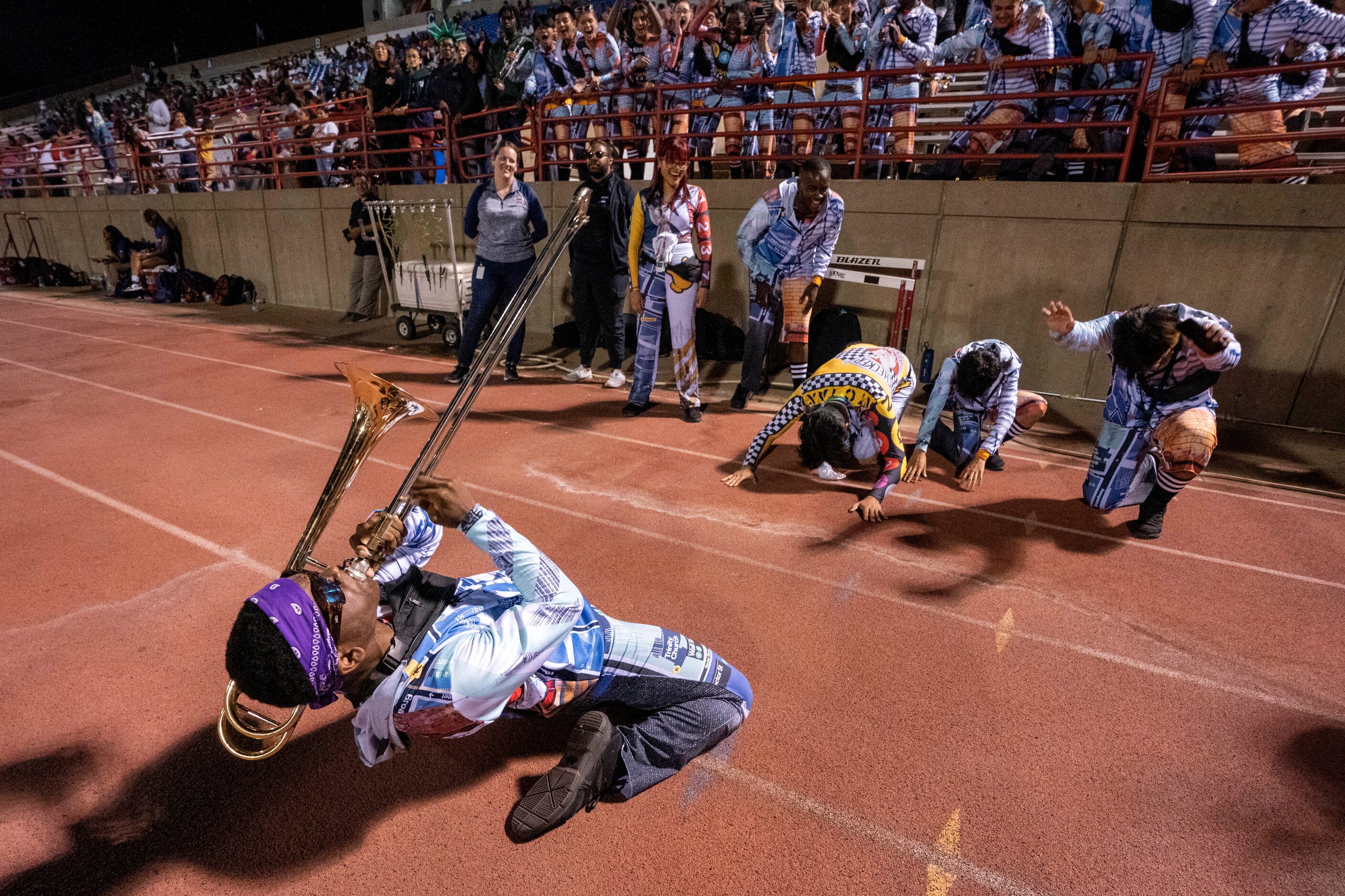 Duncanville junior trombone player Xzavier Elliott leads the band during the second half of...