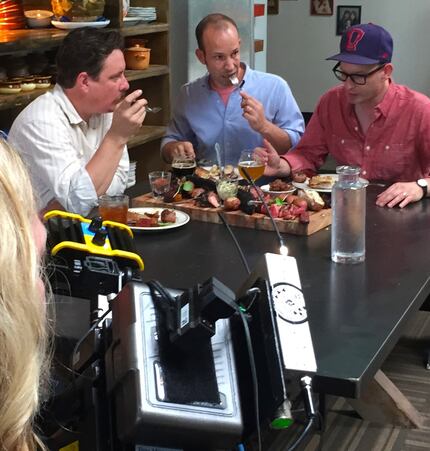 A cameraman films as chef Tim Byres (left), Matt Lee (center) and Ted Lee shoot part of...