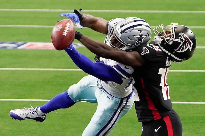 FILE - Cowboys cornerback Chidobe Awuzie (24) breaks up a pass intended for Falcons wide...