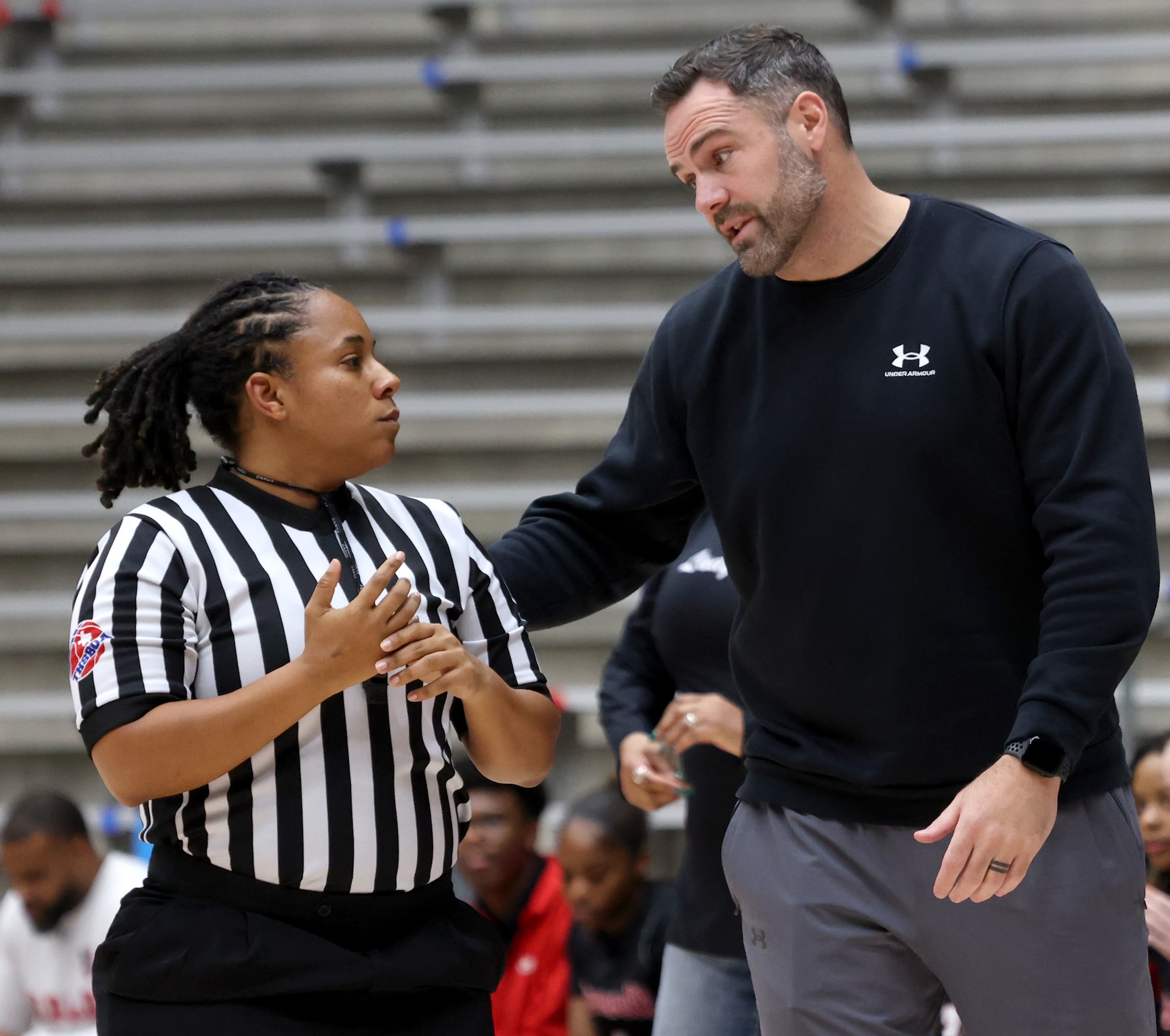 Denton Guyer head coach Jake Floyd questions the lack of a call with a game official during...