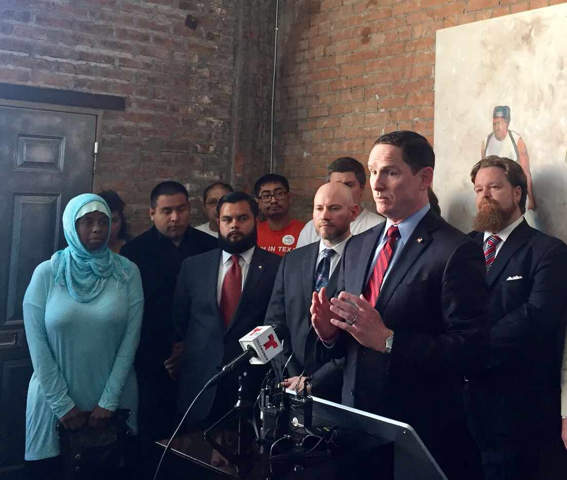 Dallas County Judge Clay Jenkins addresses a news conference at the Latino Center for...