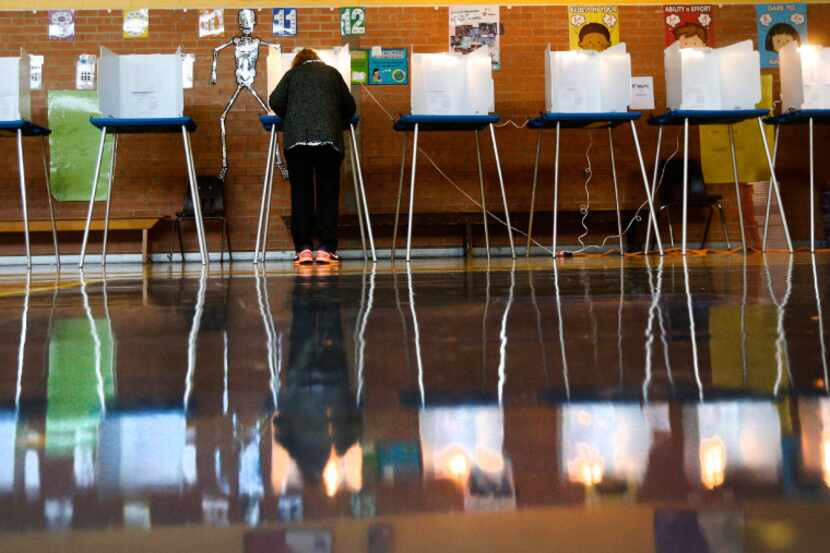 A woman votes at Precinct 4069 in Winnetka Elementary School in Dallas on Nov. 8, 2016.