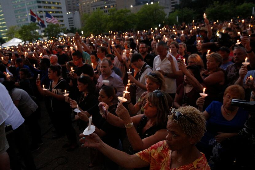 Dallas residents, some of whom gathered this week at City Hall for a vigil for slain...