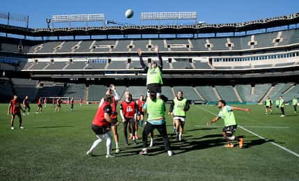Dallas Jackals rugby players play a throw-in during practice at Choctaw Stadium in...