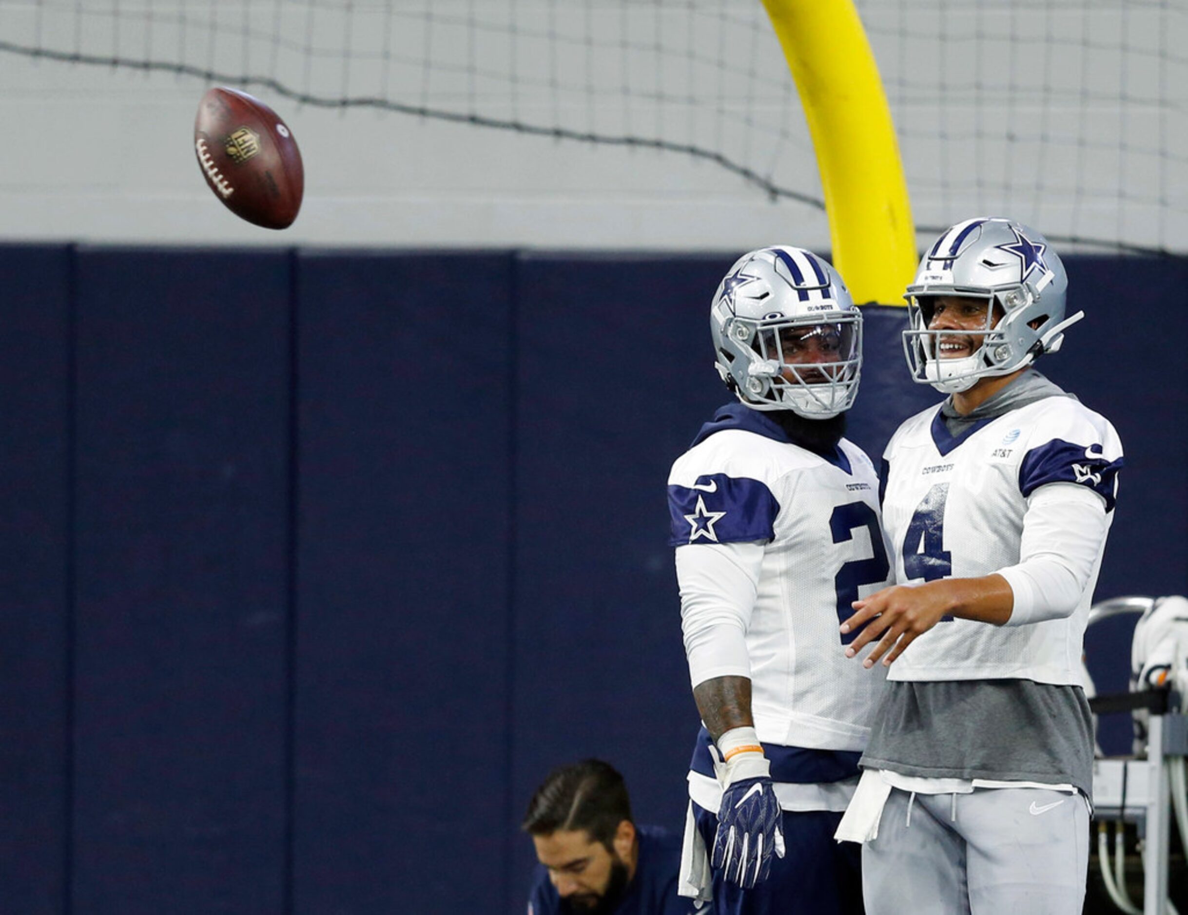 Dallas Cowboys running back Ezekiel Elliott (21) and Dallas Cowboys quarterback Dak Prescott...