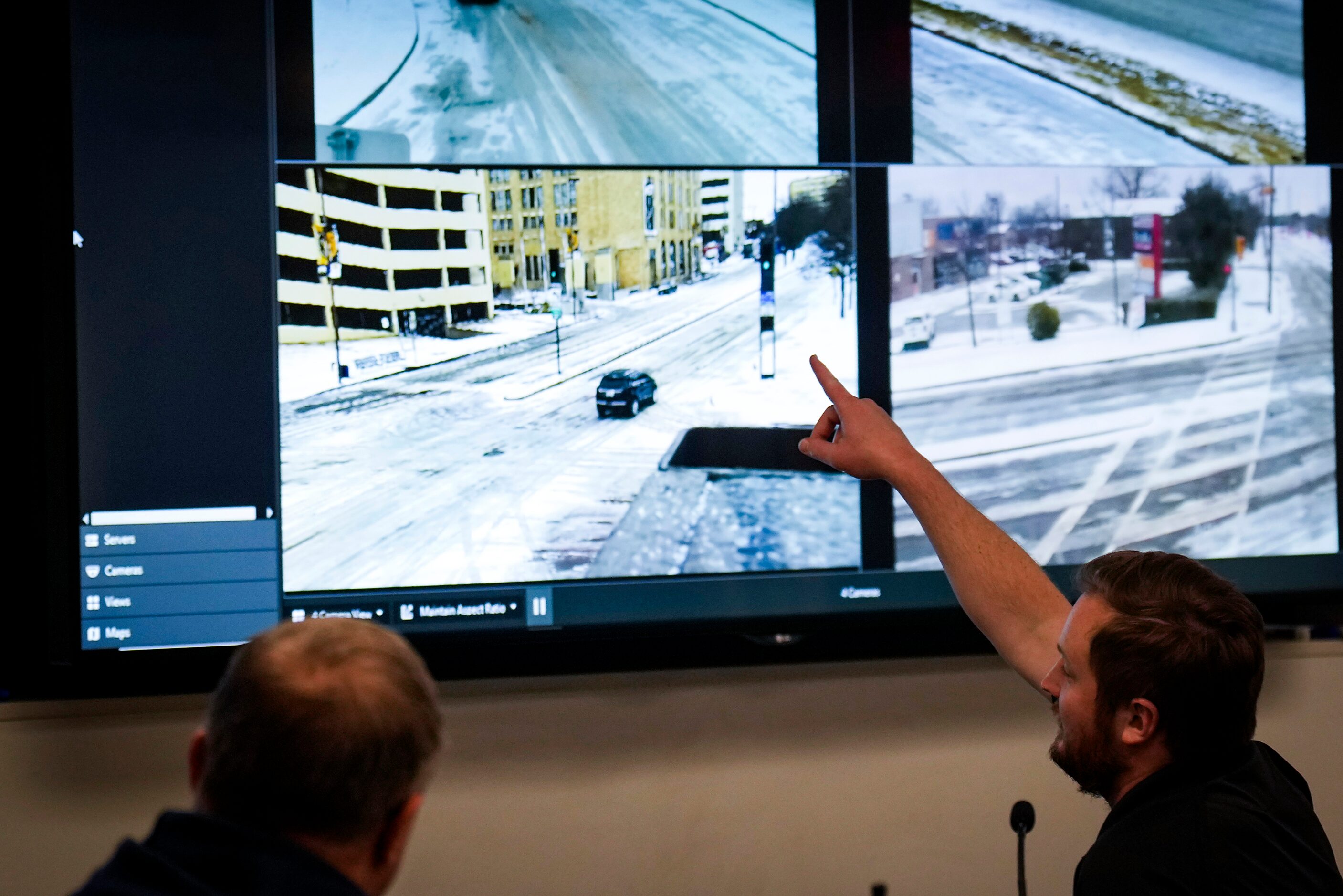 Monitors show views of various traffic conditions in the Dallas Emergency Operations Center...