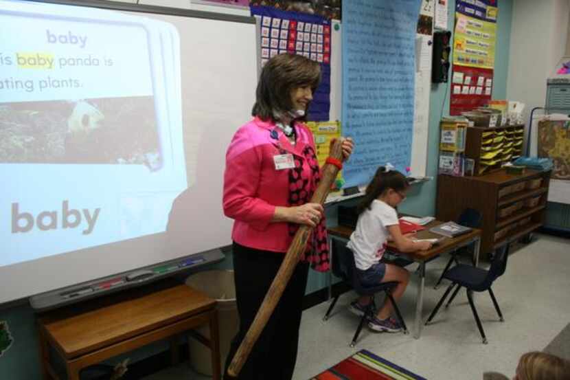 
Pam Taylor gets her students’ attention with a rain stick near the end of an instructional...