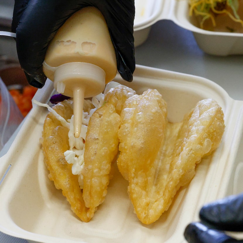 Taco Wasted’s Nick Cantillo, 17, prepares a pair of puffy tacos.