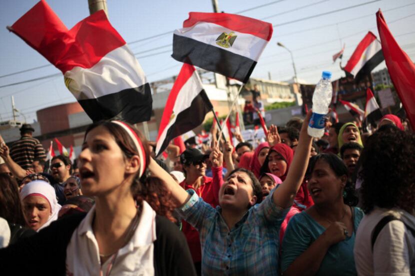 Opponents of Egypt's Islamist President Mohammed Morsi protest outside the presidential...
