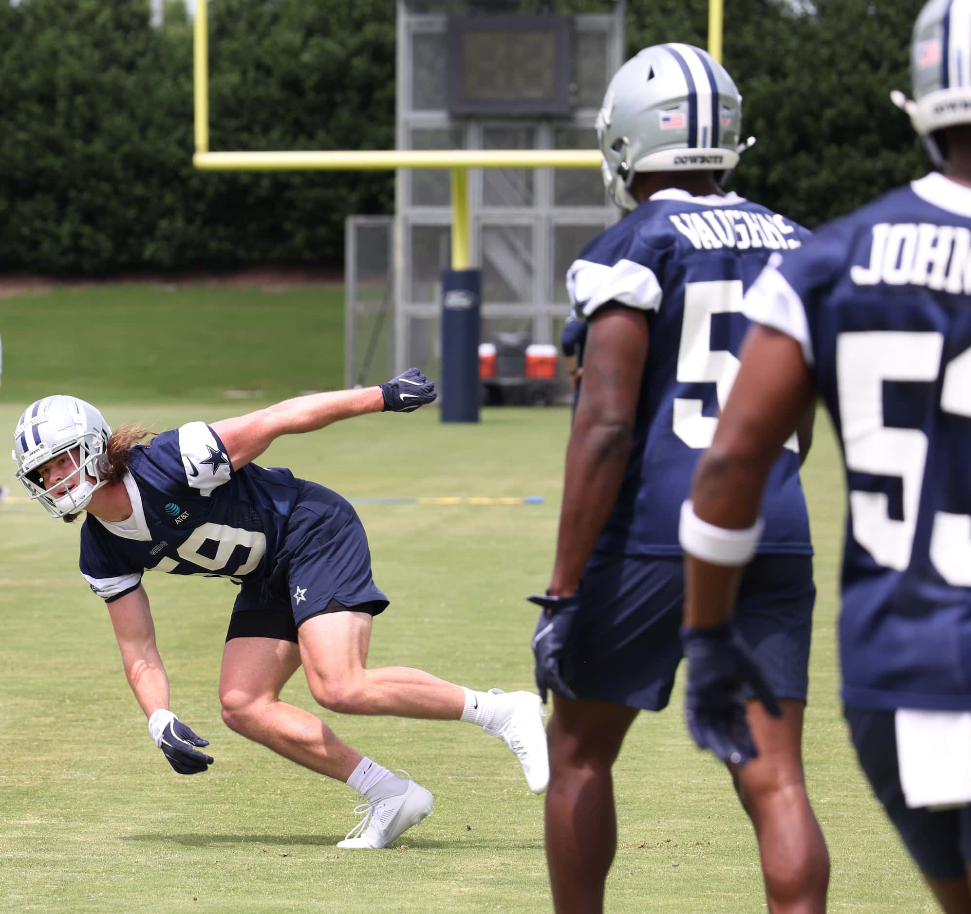 Dallas Cowboys linebacker Brock Morgensen (59) works to maintain his balance coming out of a...