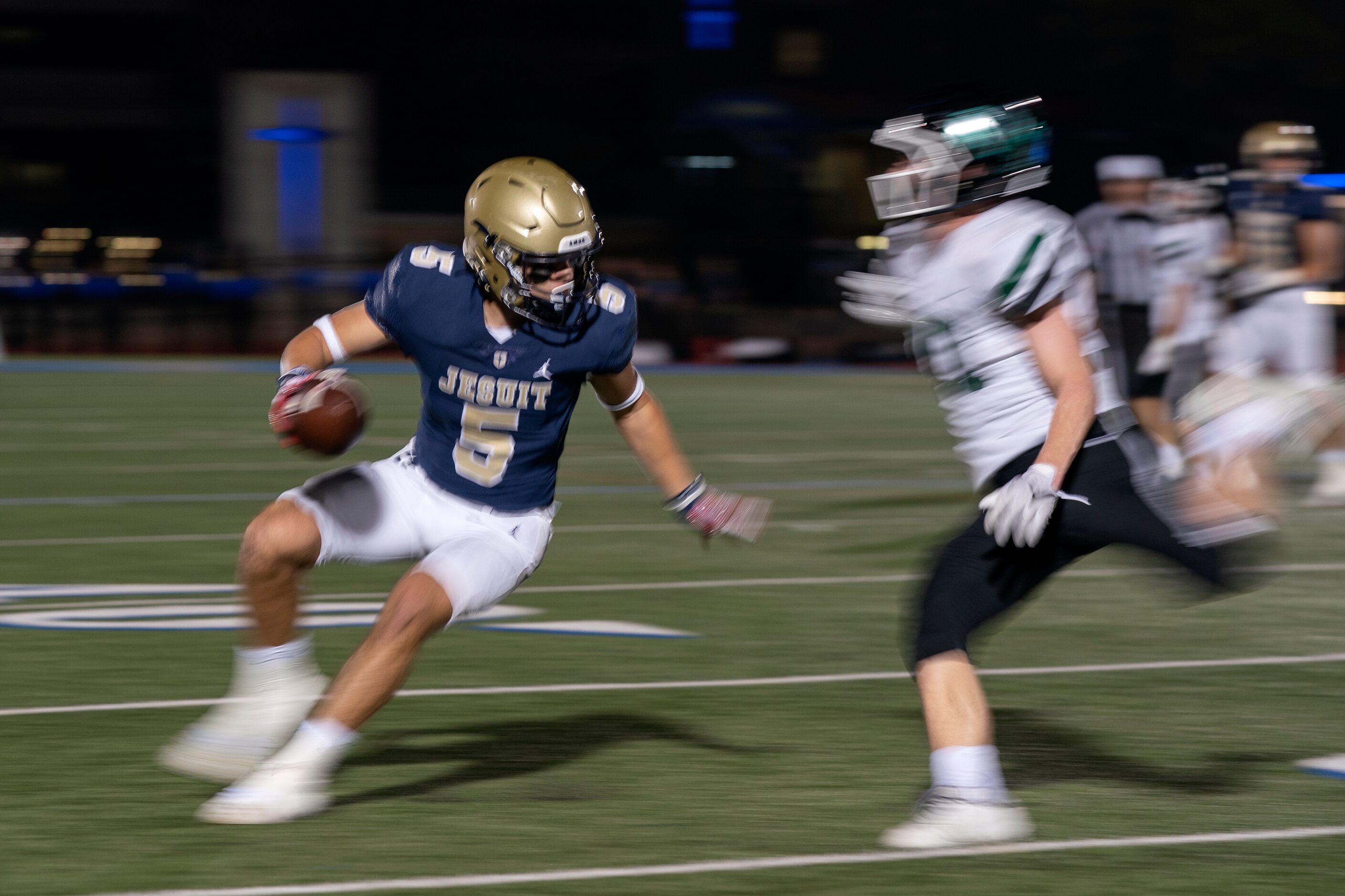 Jesuit senior wide receiver Joe Staubach (5) tries to get past Richardson Berkner senior...