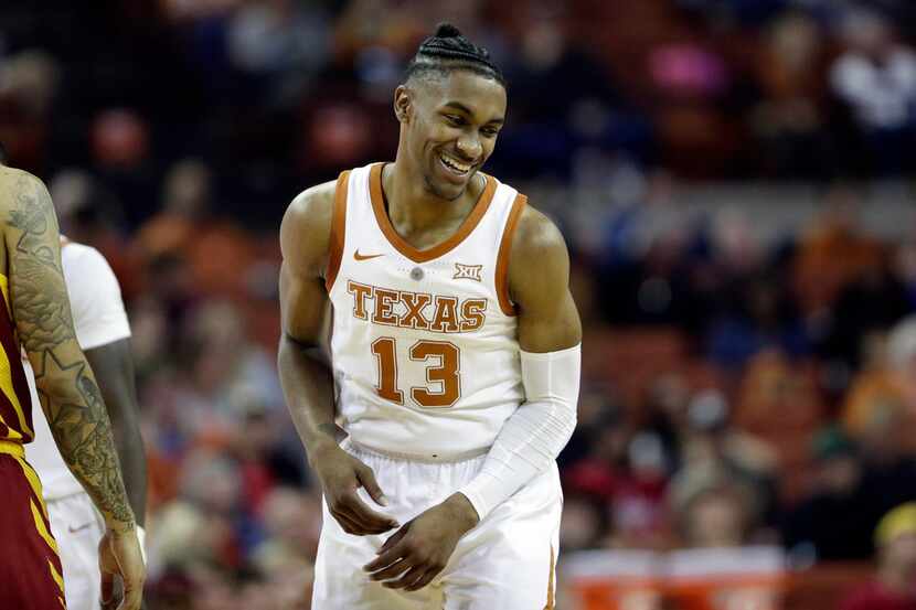 Texas guard Jase Febres (13) celebrates after a play during the second half of an NCAA...