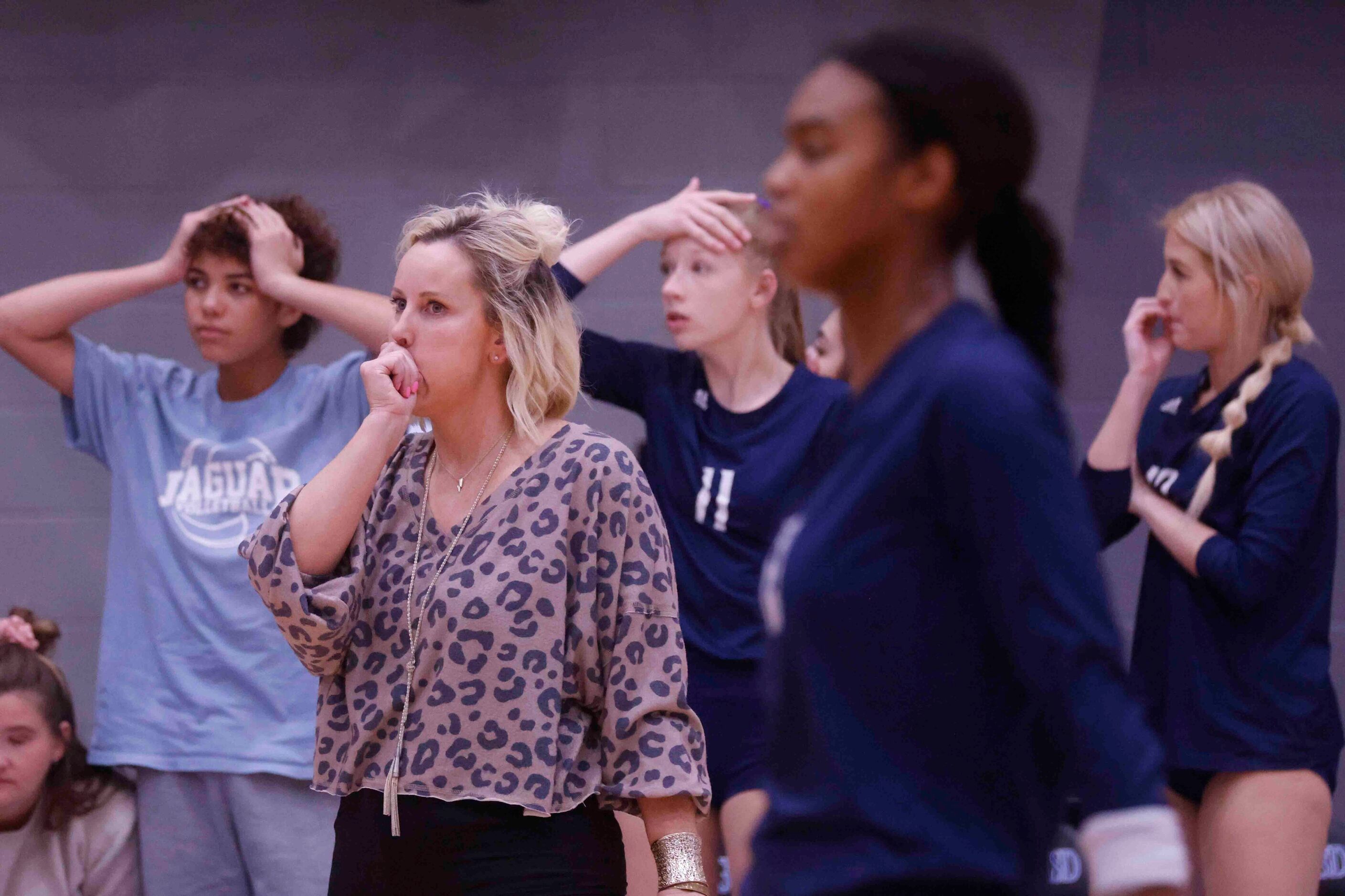 Flower Mound head coach Jamie Siegel and bench players react to a point loss against...