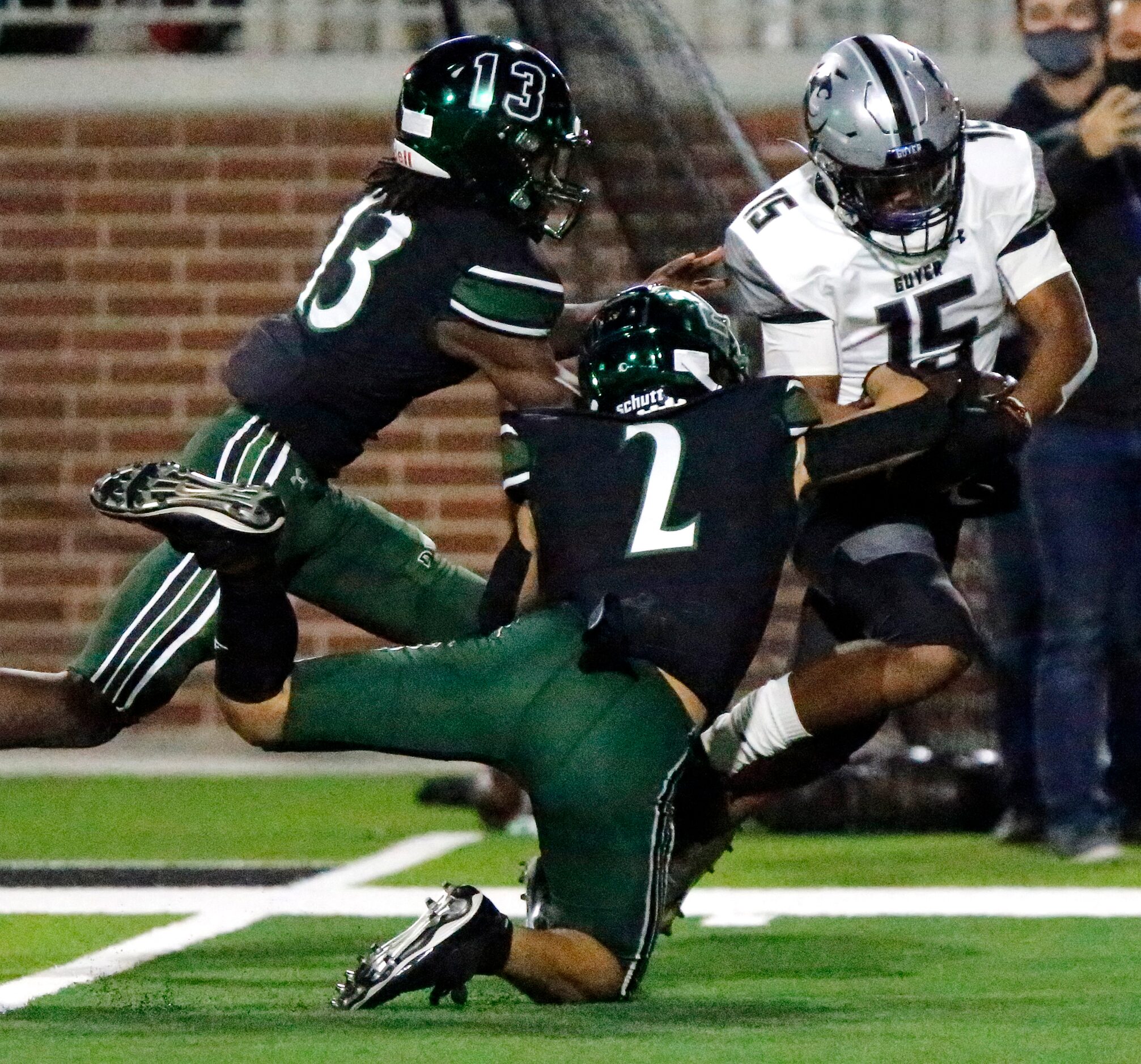 Denton Guyer High School wide receiver D'marcus Howard (15) is brought down by Prosper High...