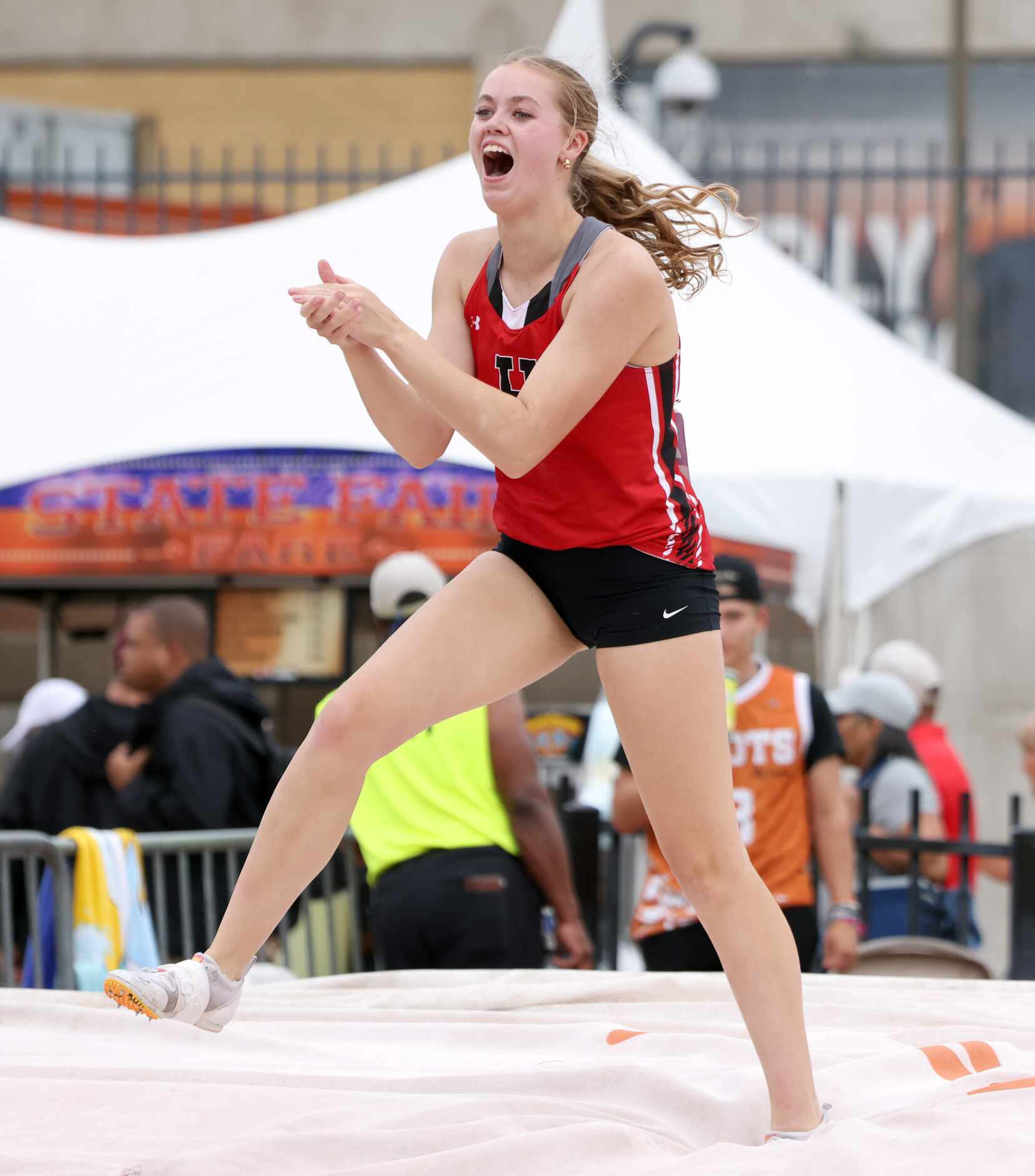 Rockwell-Heath's Brooklyn Nalley celebrates her successful vault of 12-9.00. She finished...