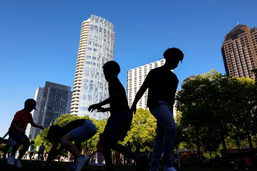 Kids play on the open lawn of Klyde Warren Park on Sunday, April 7, 2024 in Dallas. The...