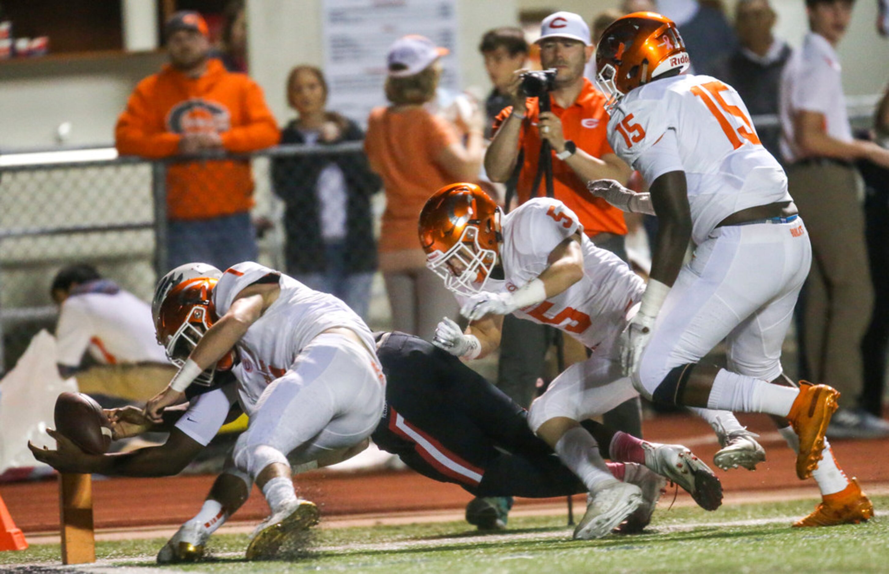 Melissa quarterback Brendon Lewsi (1) dives into the end zone for a touchdown during the...