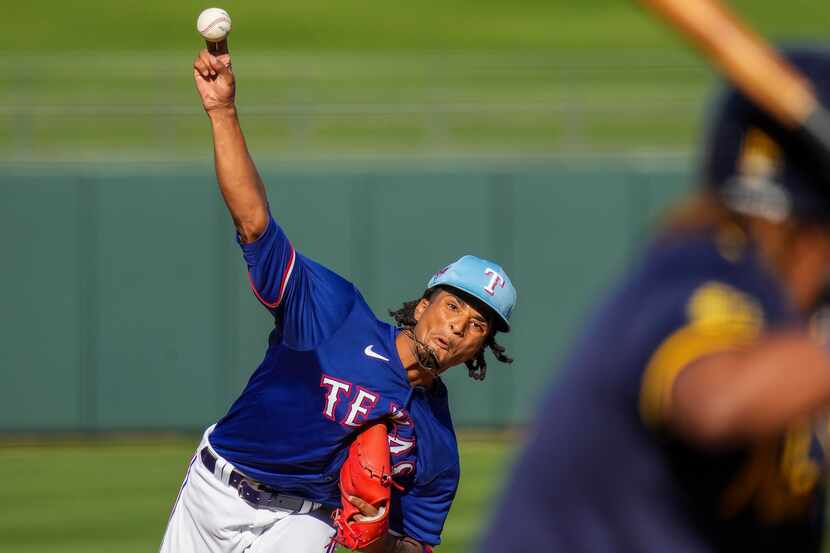 Texas Rangers pitcher Marc Church delivers during the ninth inning of a spring training game...