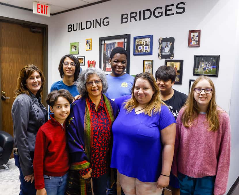 Science teacher Saba Ansari (center) stood with students and staff at Bridge Builder Academy...