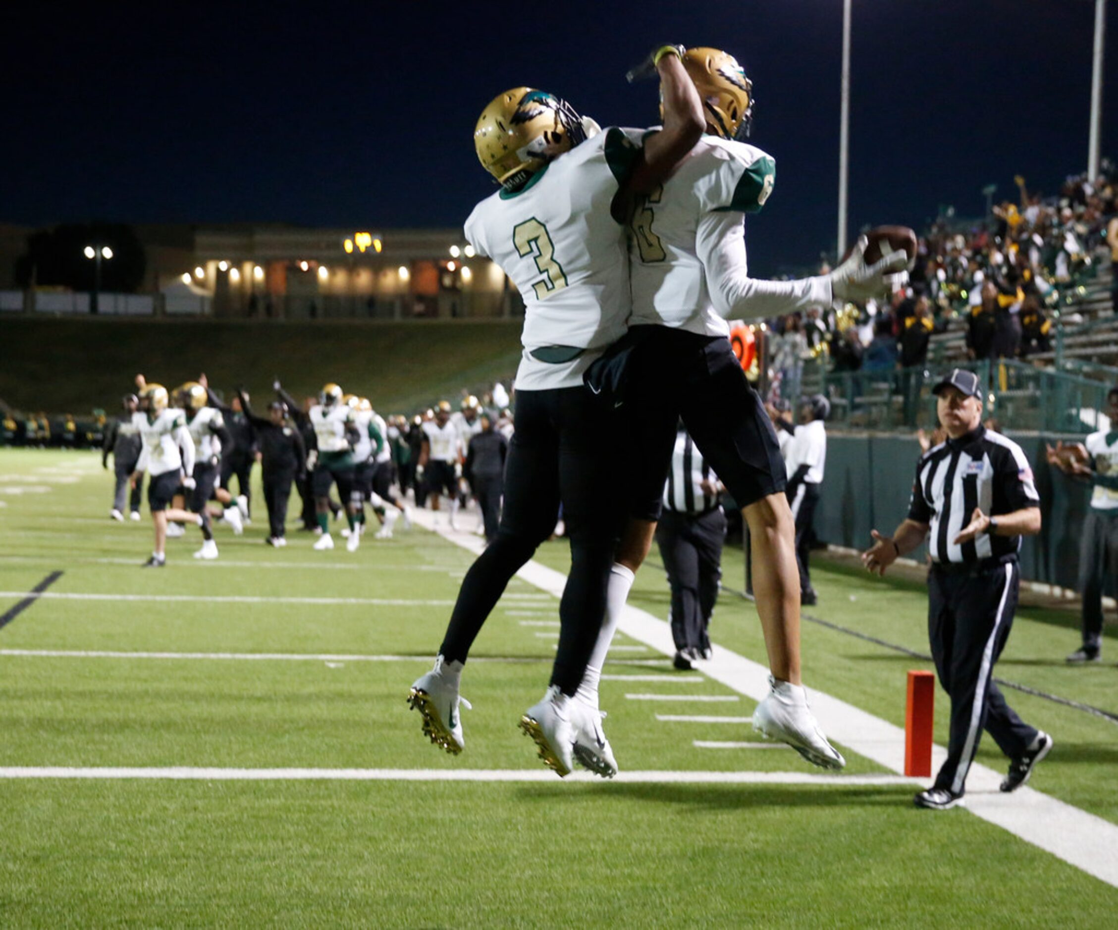 Desoto's Byron Hanspard congratulates Lawrence Arnold Jr. after his touchdown catch during...