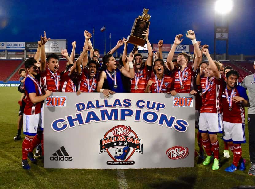 FC Dallas hoists the 2017 Dallas Cup Super Group trophy.  They were the 2nd domestic side to...