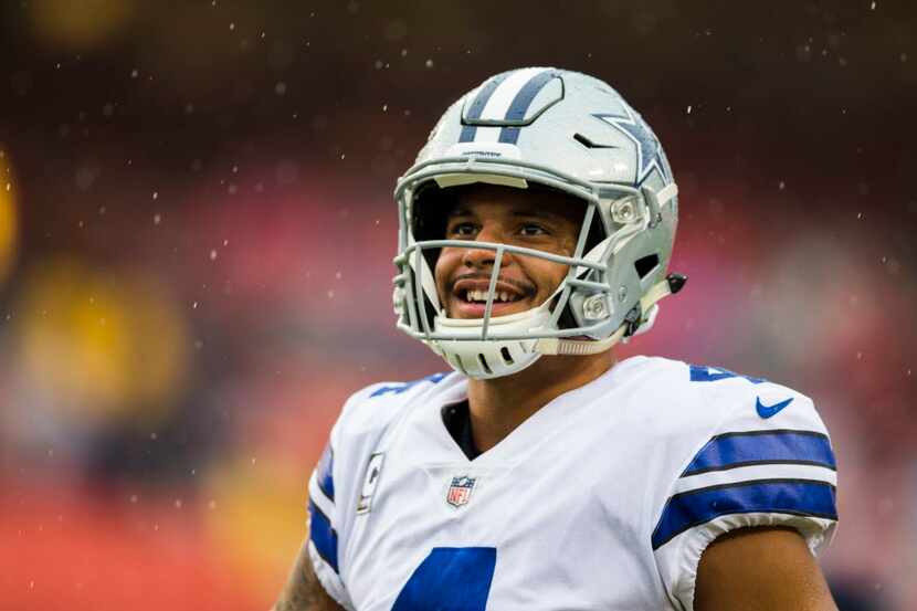 FILE — Dallas Cowboys quarterback Dak Prescott (4) smiles during warmups before an NFL game...