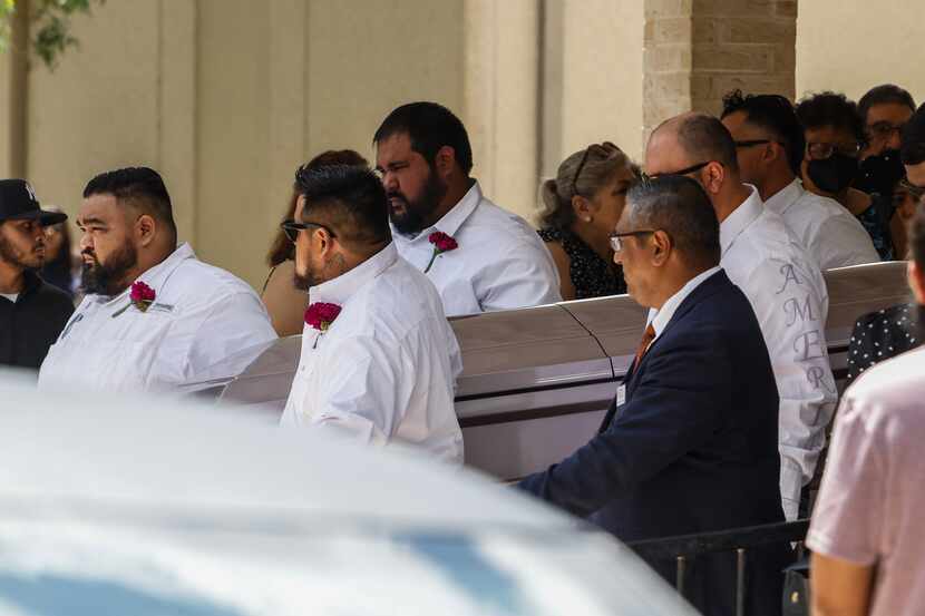 Pallbearers carry the casket of Amerie Jo Garza following funeral services at Sacred Heart...