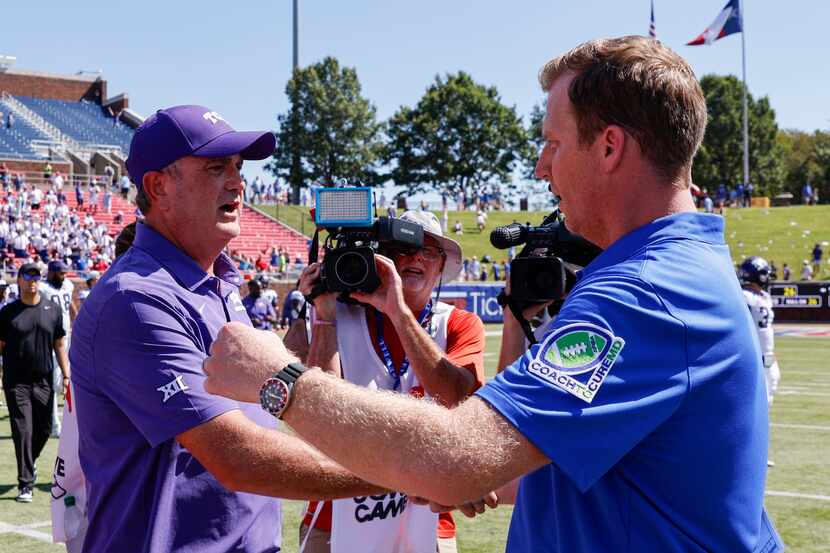 TCU head coach Sonny Dykes (left) greets SMU head coach Rhett Lashlee after a game at Ford...