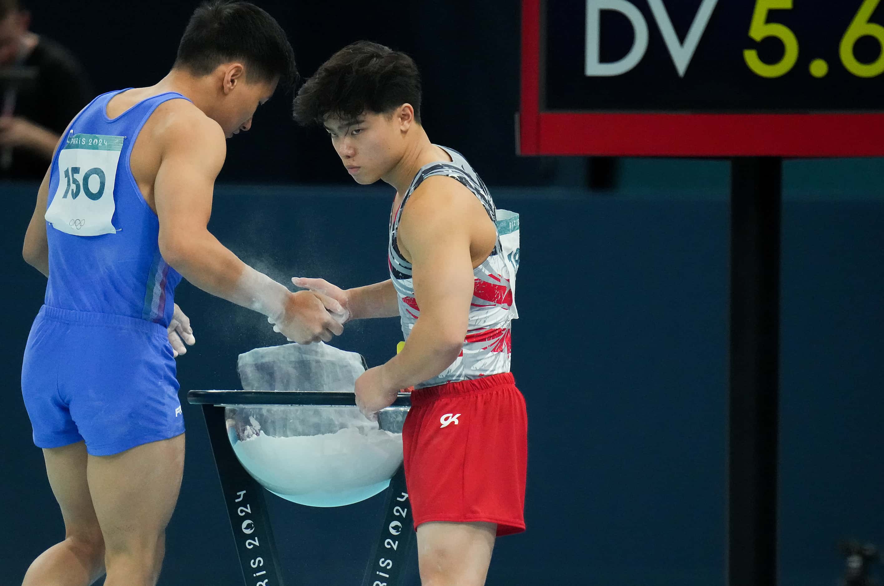 Asher Hong of the United States shakes hands with Lorenzo Minh Casali (15) before he...