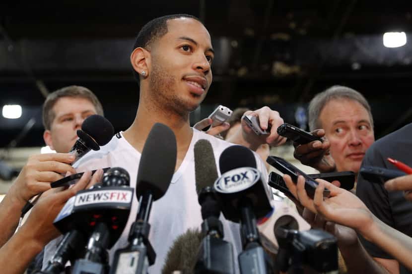 Dallas Mavericks guard Devin Harris (20) talks to the media the day after losing to the San...