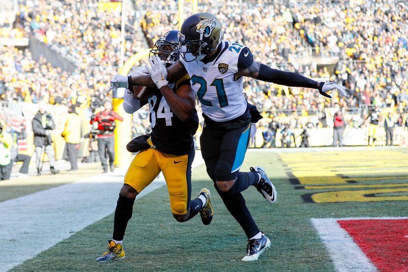 PITTSBURGH, PA - JANUARY 14:  Antonio Brown #84 of the Pittsburgh Steelers catches a pass in...