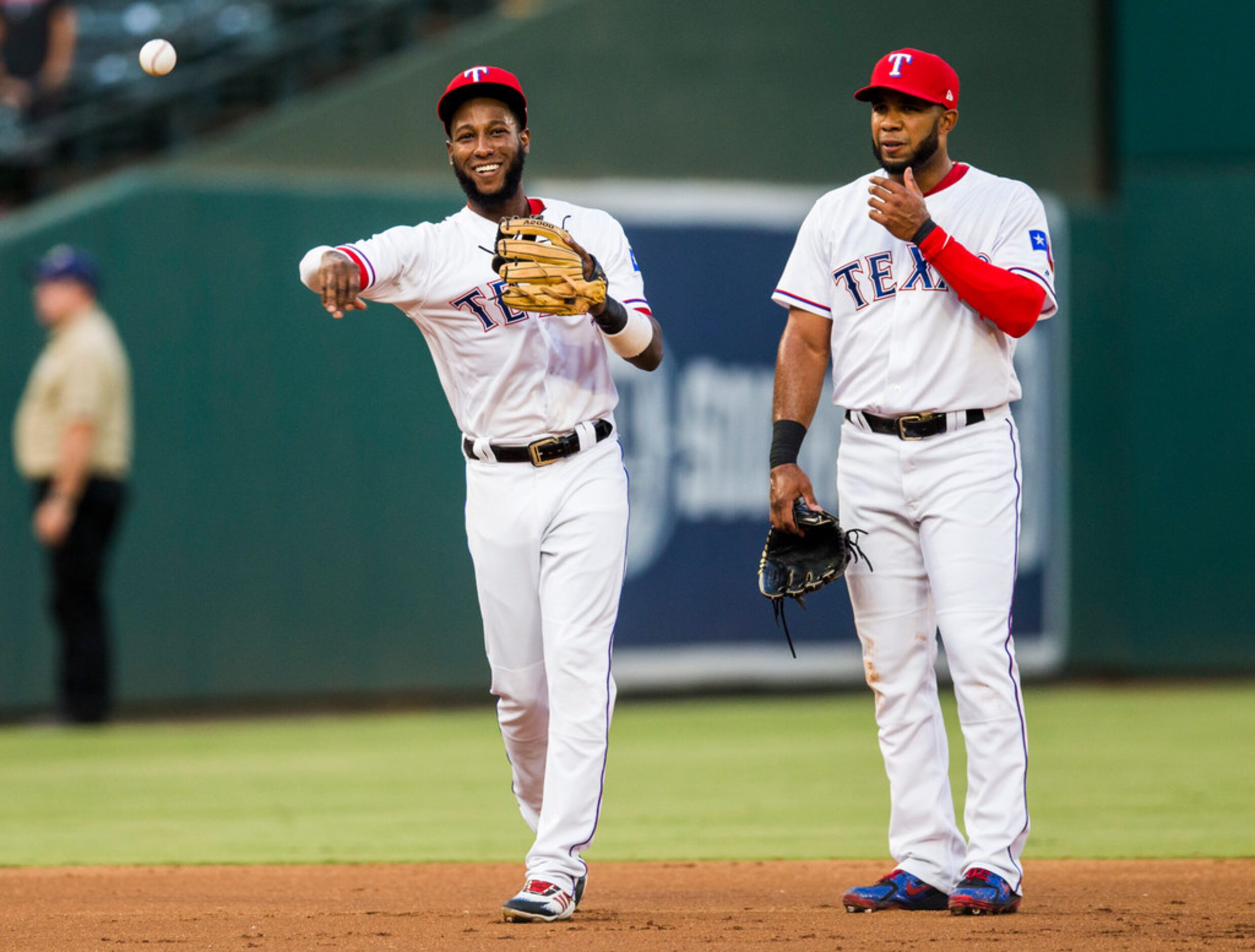 Texas Rangers shortstop Jurickson Profar (19) and shortstop Elvis Andrus (1) warm up before...