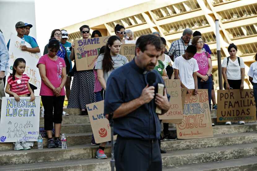 After a walk from Our Lady of Guadalupe Cathedral, protesters prayed Thursday with Pastor...