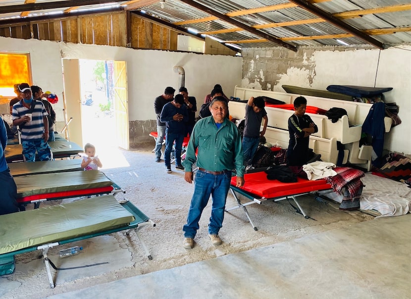 Pastor Jose Medrano stands inside his shelter-turned-ministry, Casa de Oracion El Peregrino...