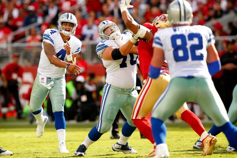 Dallas Cowboys quarterback Dak Prescott (4) throws a third quarter pass to Dallas Cowboys...