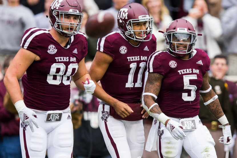 Texas A&M Aggies tight end Trevor Wood (80), quarterback Kellen Mond (11) and running back...