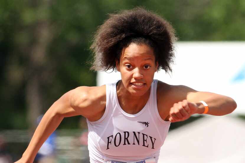 Forney's Kiana Hawn clears the final hurdle enroute to her first place win in the girls 100...