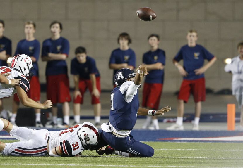 Allen's Seth Green (7) heaves a ball in the air that led to an interception as Flower Mound...