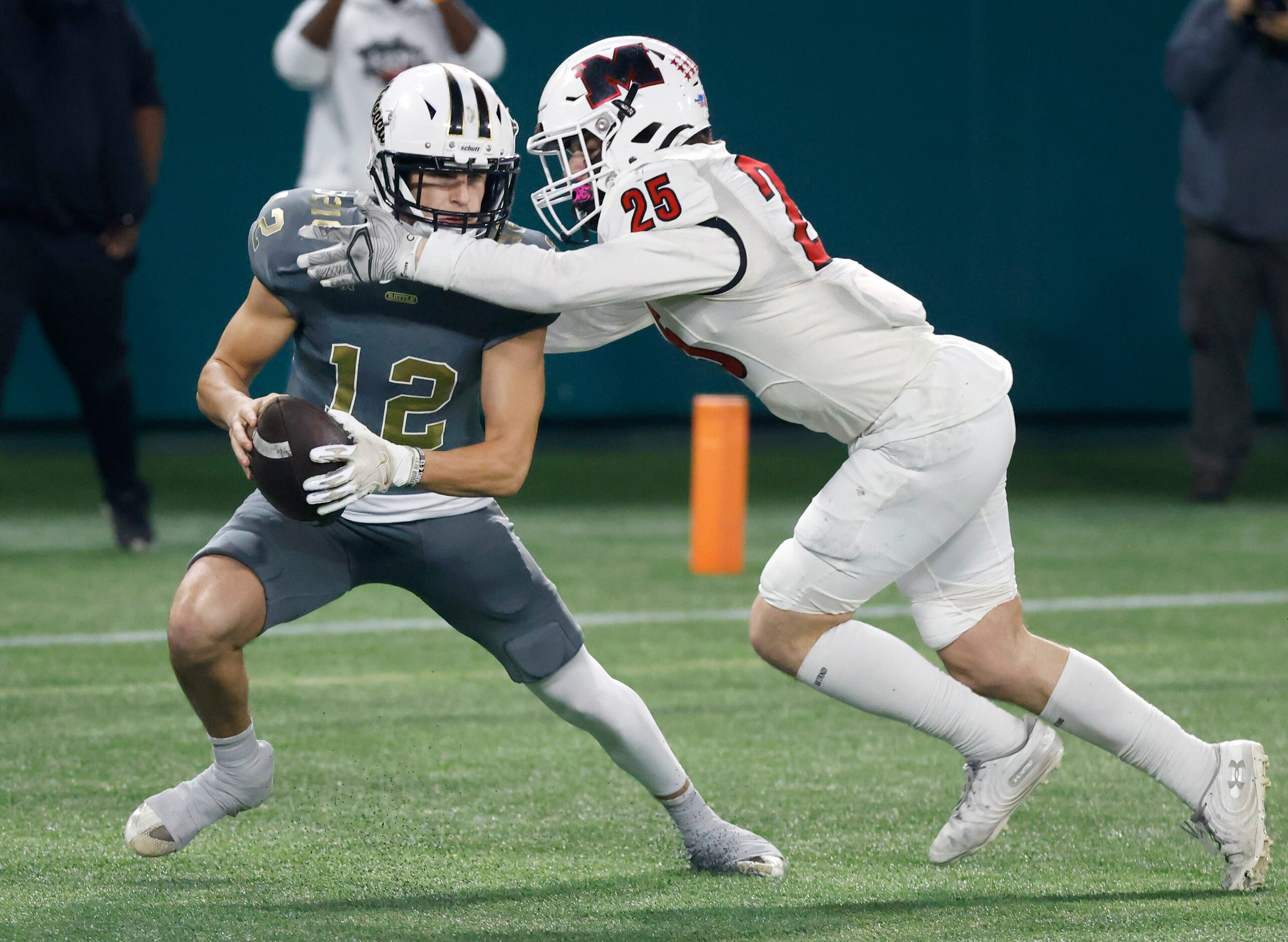 South Oak Cliff punter Carter Kopecky (12) is tackled in the end zone by Melissa Landen...