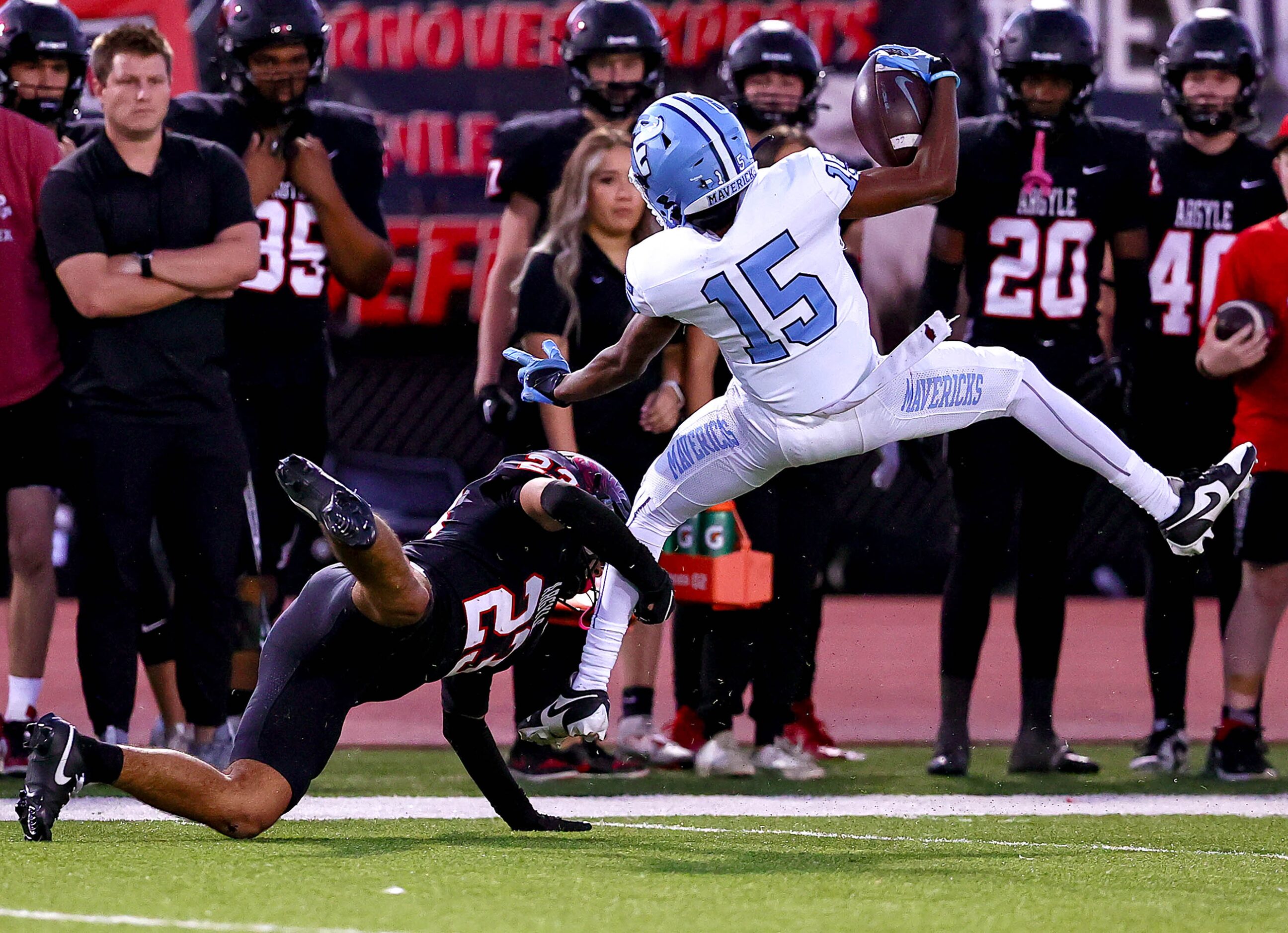 Frisco Emerson wide receiver Cameron Newborn (15) gets tripped up by Argyle defensive back...