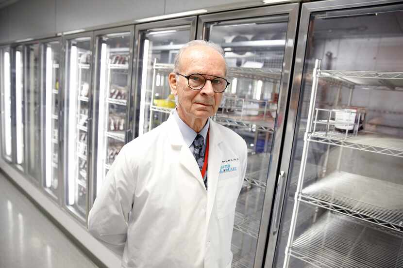 President and CEO of Carter BloodCare, Dr. Merlyn Sayers, is pictured before an empty cooler...