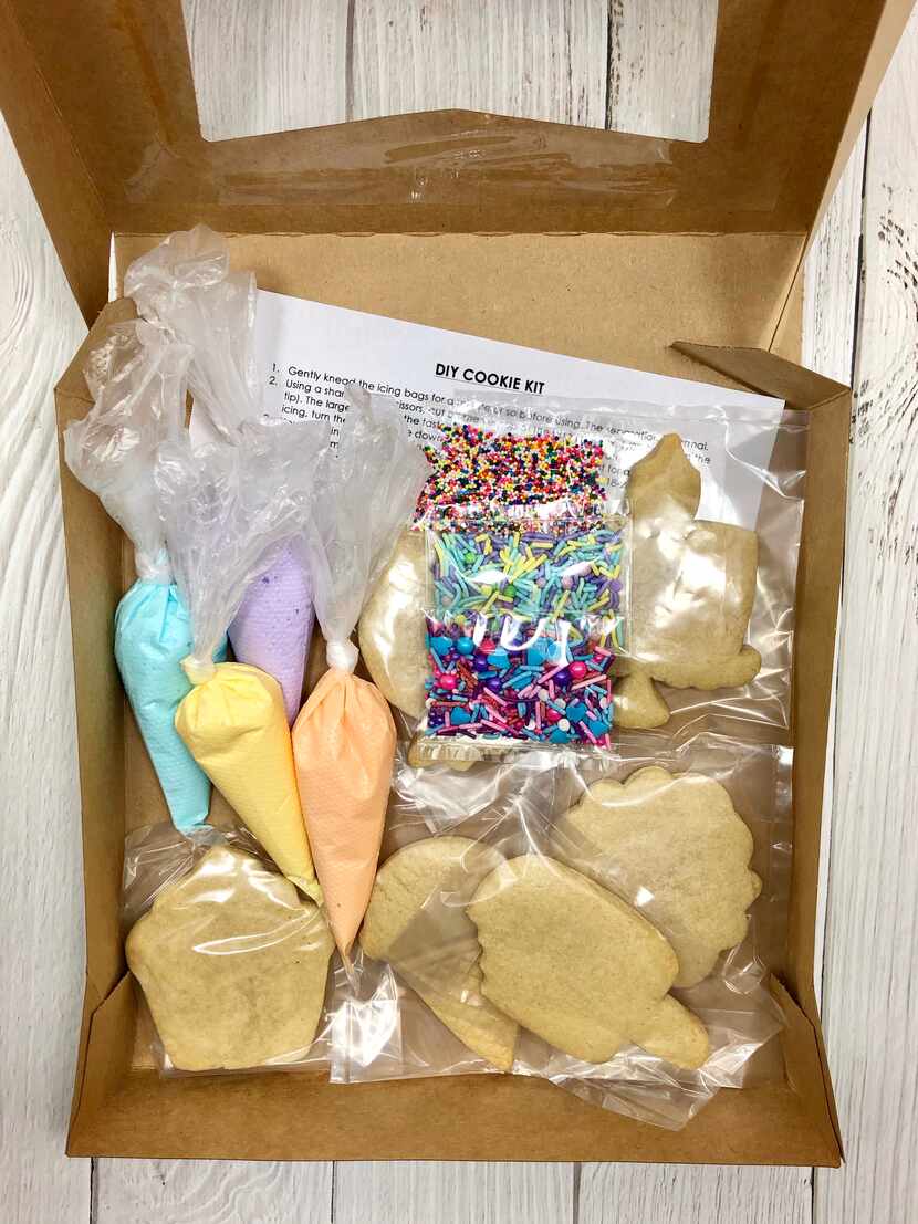 Amy Kerber Cookies & Cakes is selling a package of six sugar cookies with four small piping...