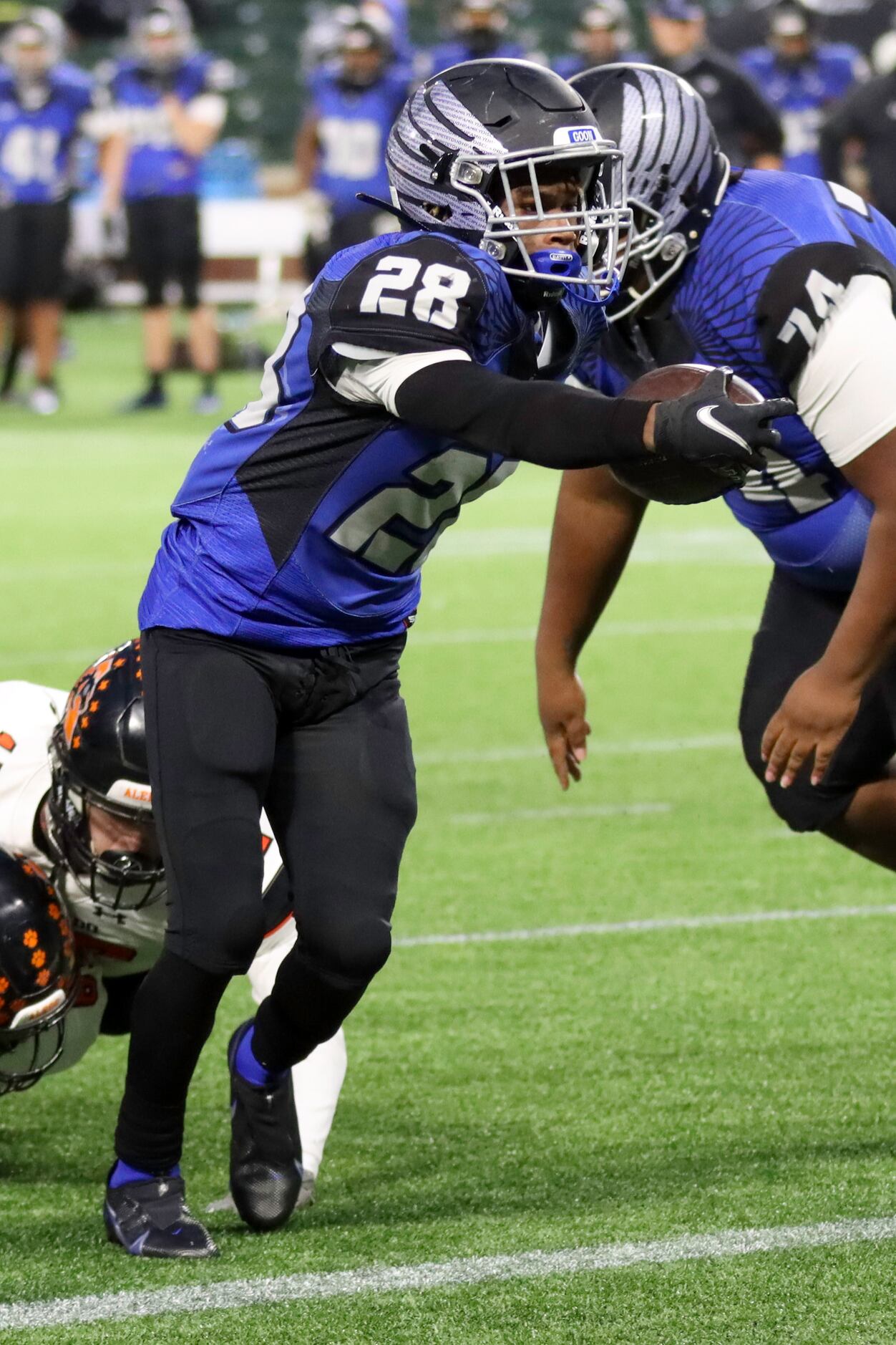 North Forney running back Jermaine Oakley (28) stretches the ball across the goal line...
