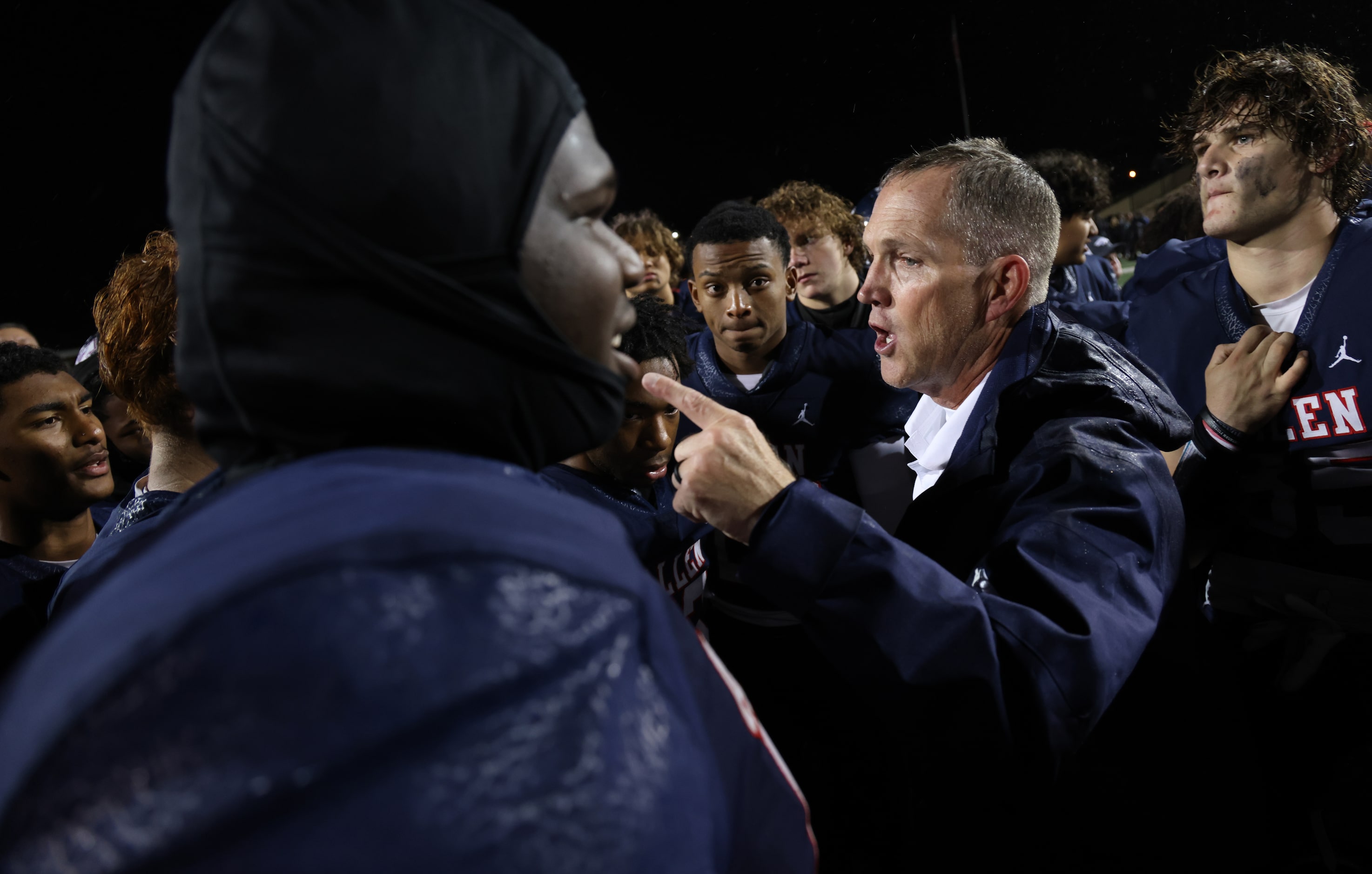 Allen head coach Lee Wiginton makes a point while speaking with his team after their 1-point...