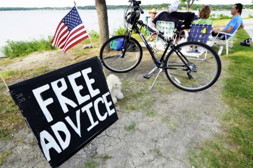 The homemade sign at White Rock Lake catches the attention of many people who drop in for...