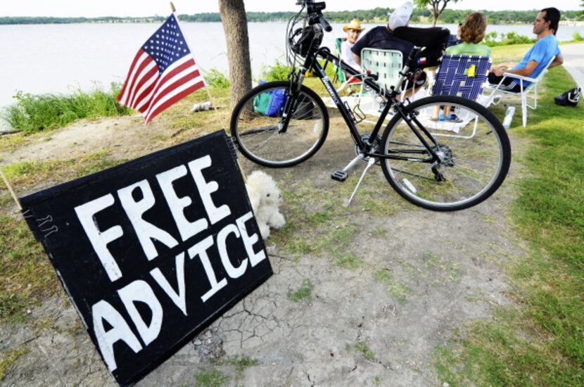 The homemade sign at White Rock Lake catches the attention of many people who drop in for...